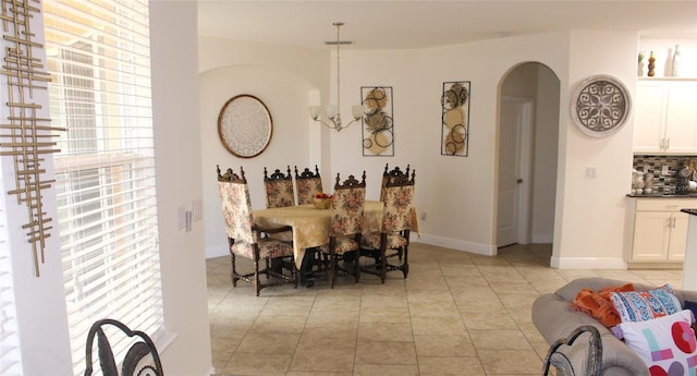 dining area featuring a notable chandelier