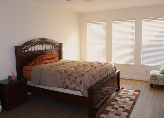 bedroom with hardwood / wood-style flooring