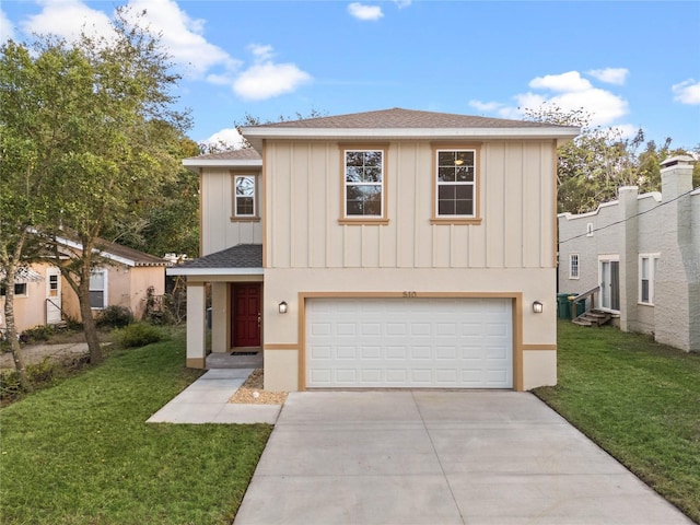 view of front of property featuring a garage and a front lawn