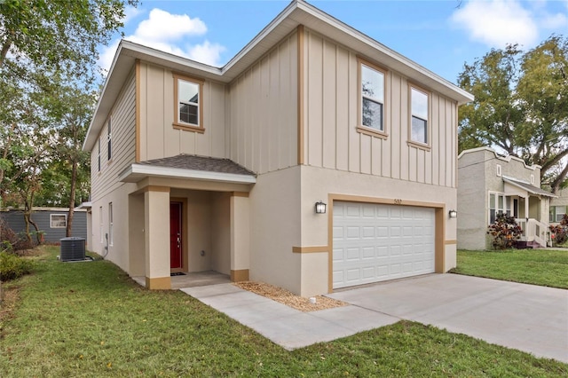 view of front of house featuring a garage, central air condition unit, and a front yard