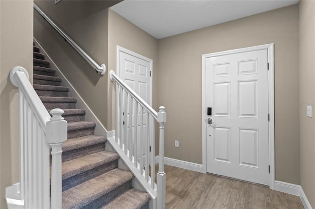 foyer with light wood-type flooring