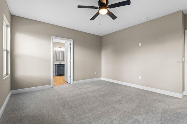 carpeted empty room with ceiling fan