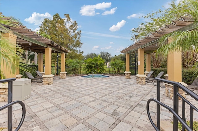 view of patio / terrace with a pergola and a swimming pool