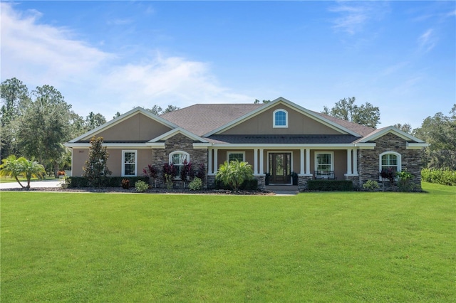 view of front facade featuring a front lawn and covered porch