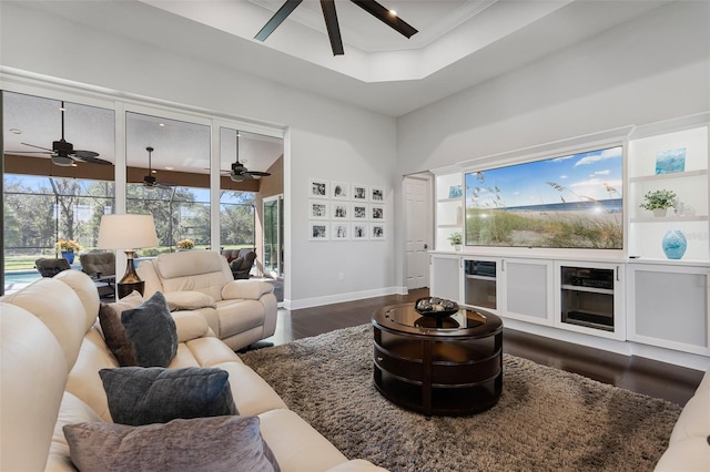 living room with dark hardwood / wood-style flooring and a high ceiling