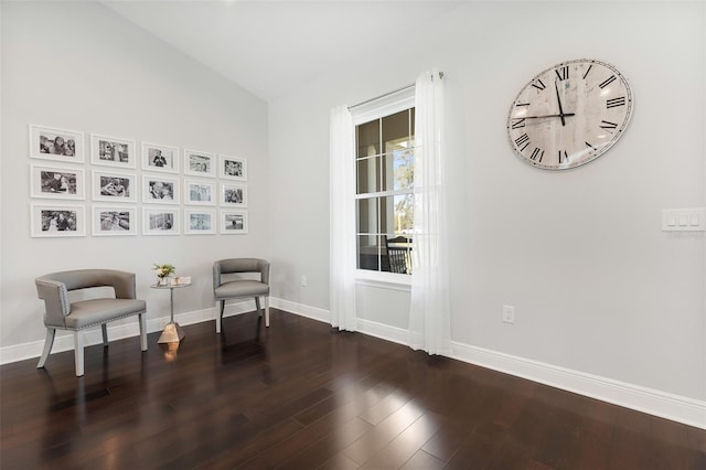 sitting room featuring dark hardwood / wood-style flooring and vaulted ceiling