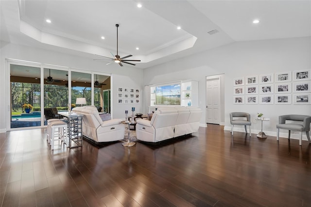 living room featuring ceiling fan, dark hardwood / wood-style flooring, and high vaulted ceiling