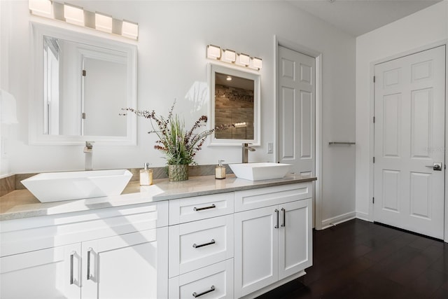 bathroom with vanity and wood-type flooring