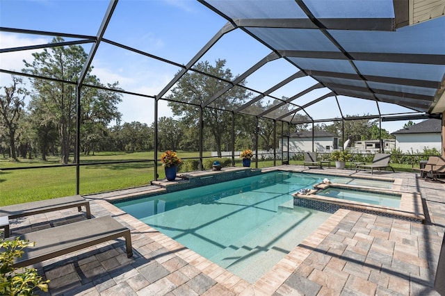 view of swimming pool featuring an in ground hot tub, a yard, a patio, and a lanai