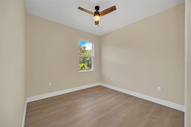 spare room featuring ceiling fan and light hardwood / wood-style floors