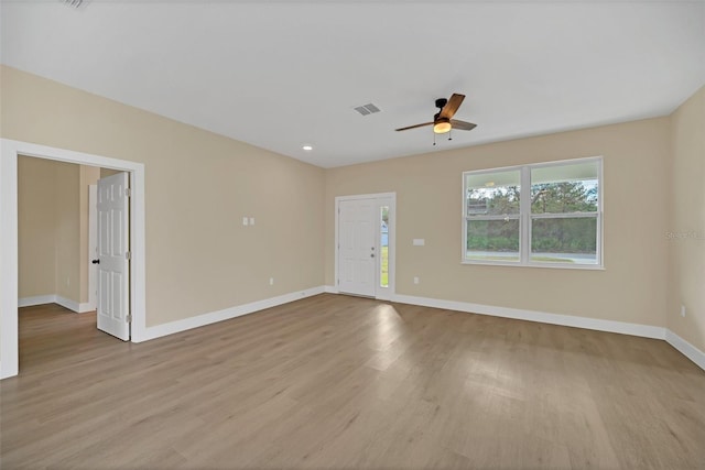 unfurnished room featuring ceiling fan and light hardwood / wood-style floors