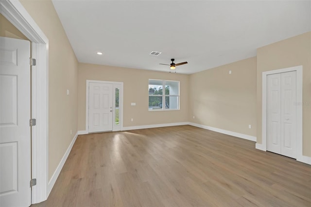 interior space with ceiling fan and light wood-type flooring