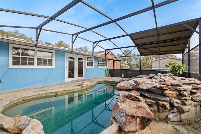 view of pool featuring french doors and glass enclosure