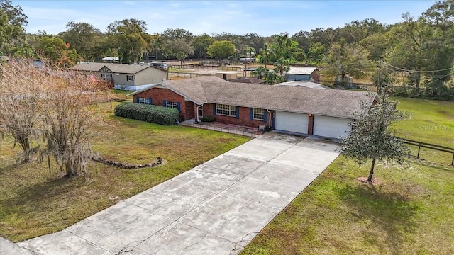 view of front of home featuring a garage and a front yard