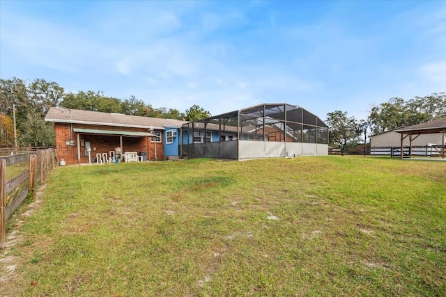 view of yard with a lanai