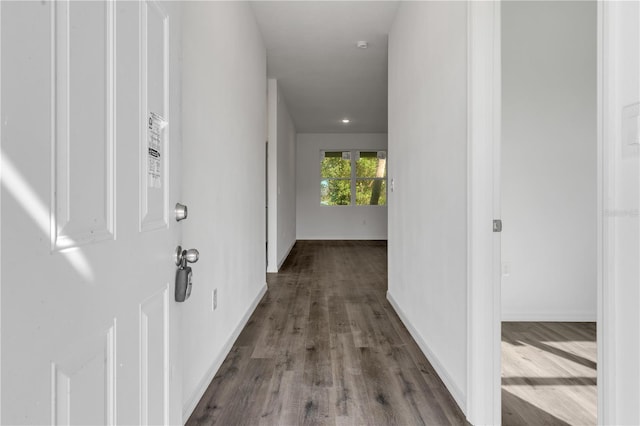 hall with hardwood / wood-style floors