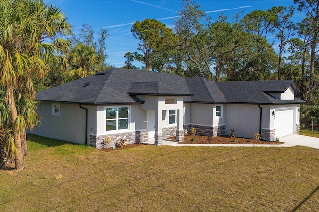 view of front of property with a garage and a front lawn