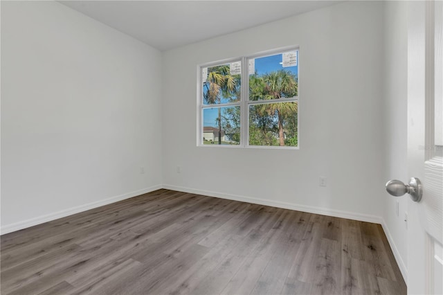 spare room with light hardwood / wood-style floors