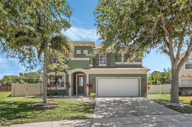 mediterranean / spanish-style home with a front lawn and a garage