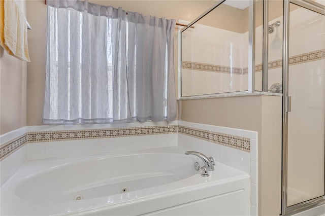 bathroom with shower with separate bathtub