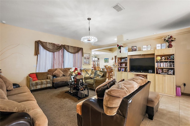 carpeted living room featuring a chandelier