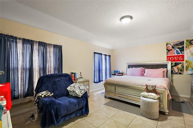 tiled bedroom with a textured ceiling