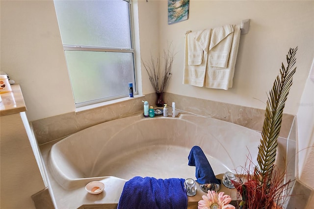 bathroom featuring a tub to relax in