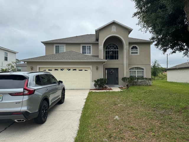 view of property with a front yard and a garage