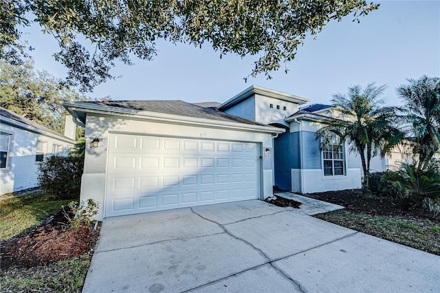 single story home with a garage