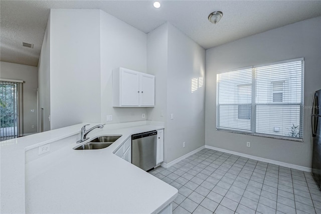 kitchen with white cabinetry, dishwasher, sink, kitchen peninsula, and a textured ceiling