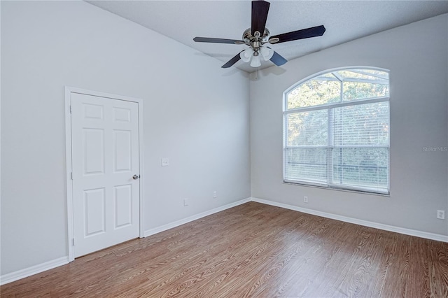 unfurnished room featuring hardwood / wood-style flooring and ceiling fan