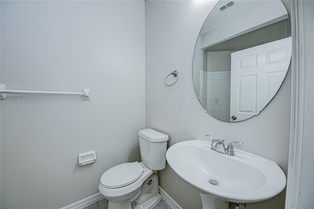 bathroom with sink and toilet