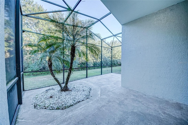 view of patio / terrace featuring a lanai