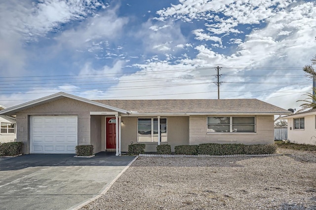 single story home featuring a garage