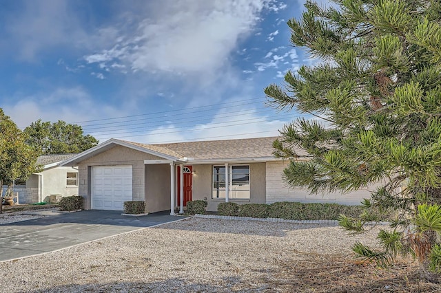 ranch-style home with a garage