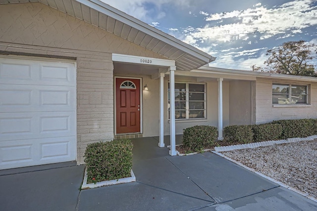 property entrance with a garage