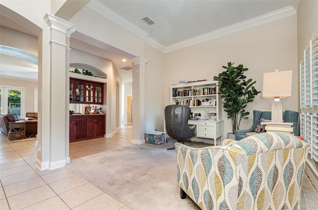 tiled living room with ornate columns, crown molding, and bar