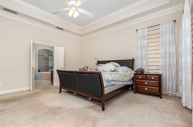 bedroom featuring light colored carpet, ensuite bath, ceiling fan, and ornamental molding