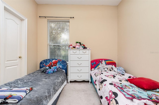 bedroom with light carpet