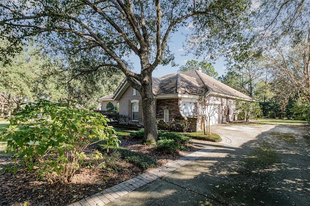 view of side of home with a garage