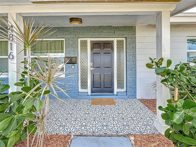 property entrance with covered porch