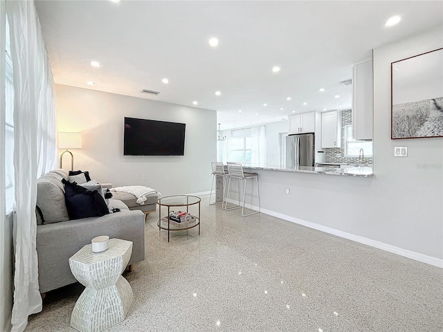 living room featuring sink