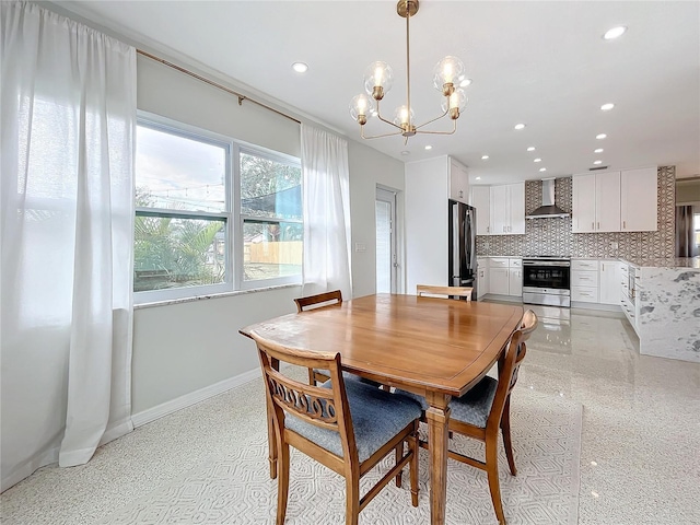 dining space featuring a chandelier