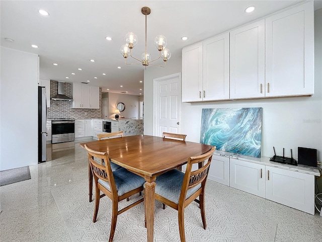 dining room with wine cooler and an inviting chandelier