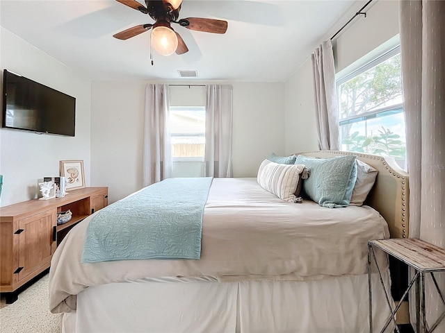 carpeted bedroom with ceiling fan