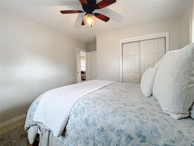 bedroom with ceiling fan, carpet floors, and a closet