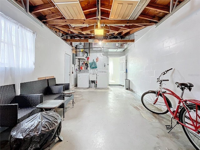 garage featuring washer and dryer, wood ceiling, and sink