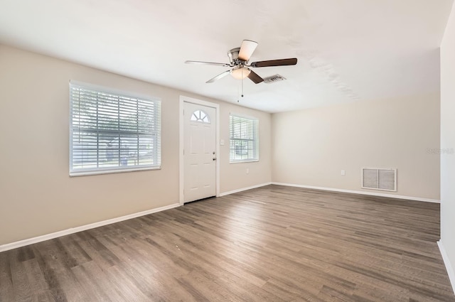 foyer entrance featuring ceiling fan and dark hardwood / wood-style flooring