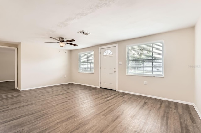 entrance foyer featuring ceiling fan and dark wood-type flooring