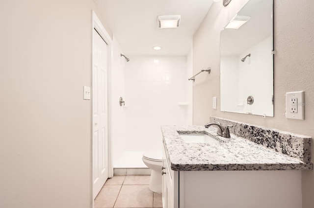 bathroom with toilet, tile patterned floors, a shower, and vanity